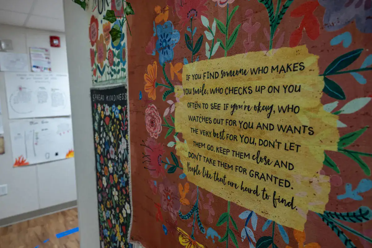 A colorful inspirational sign in a hallway at a therapeutic school.