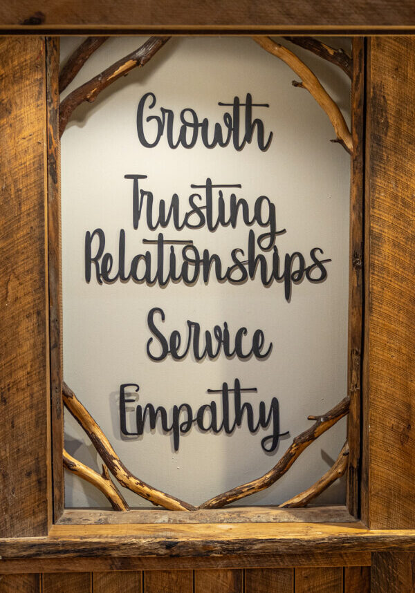 A sign listing the core values of the Lake House Academy therapeutic boarding school.